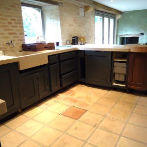 Bold dark painted French kitchen